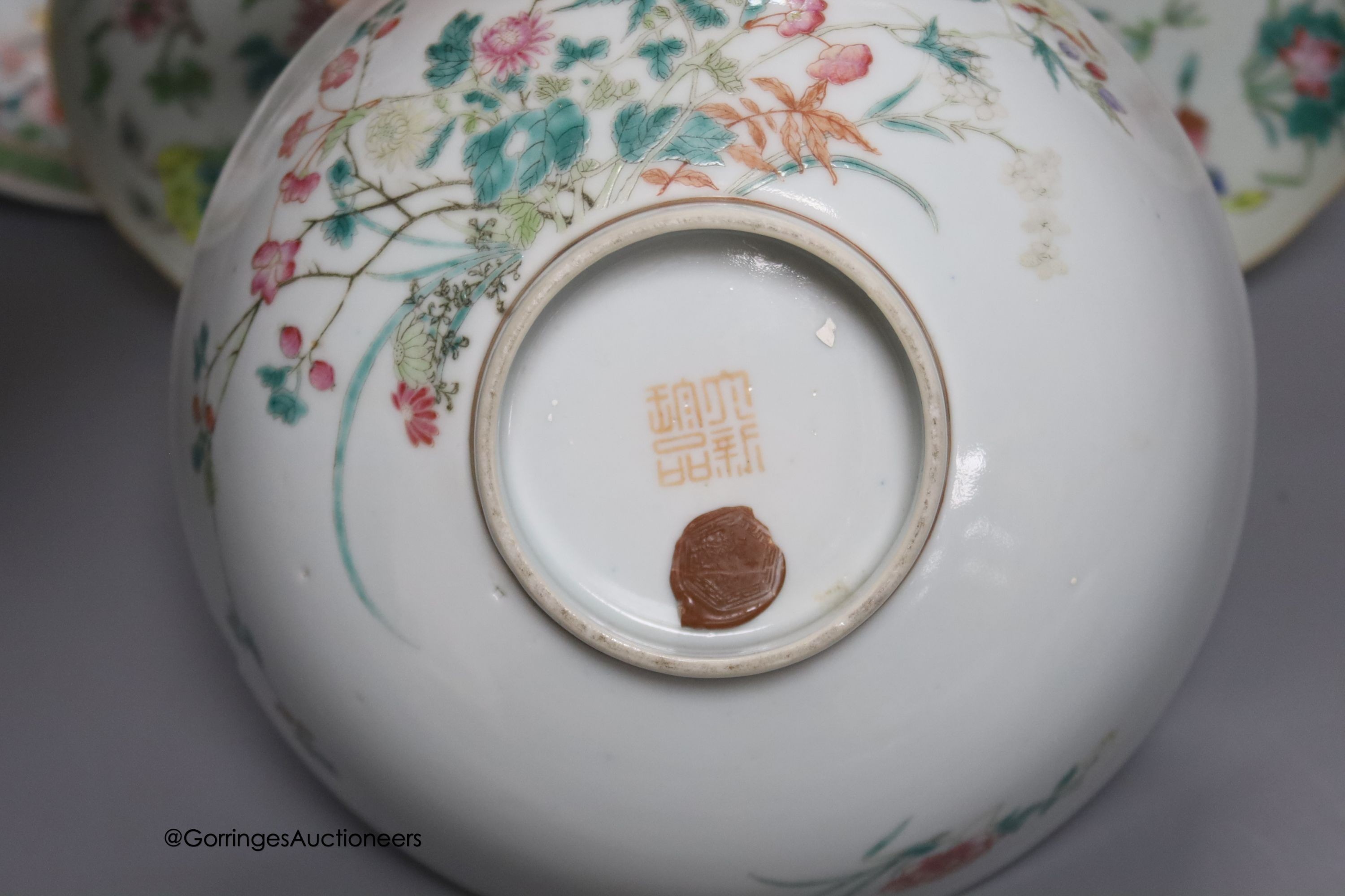 A 19th century Chinese famille rose bowl, two saucers and two 18th century Chinese famille rose plates 23cm